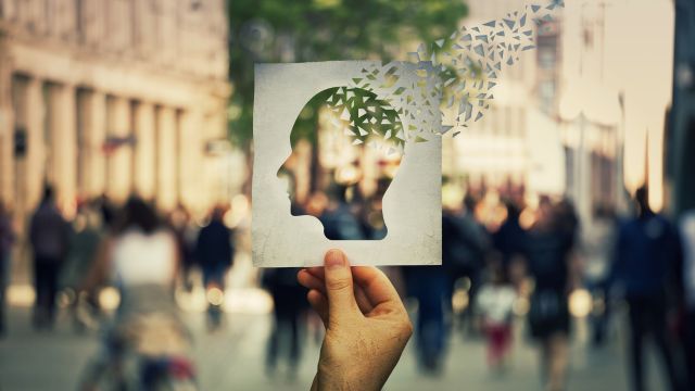 paper card with a human head design